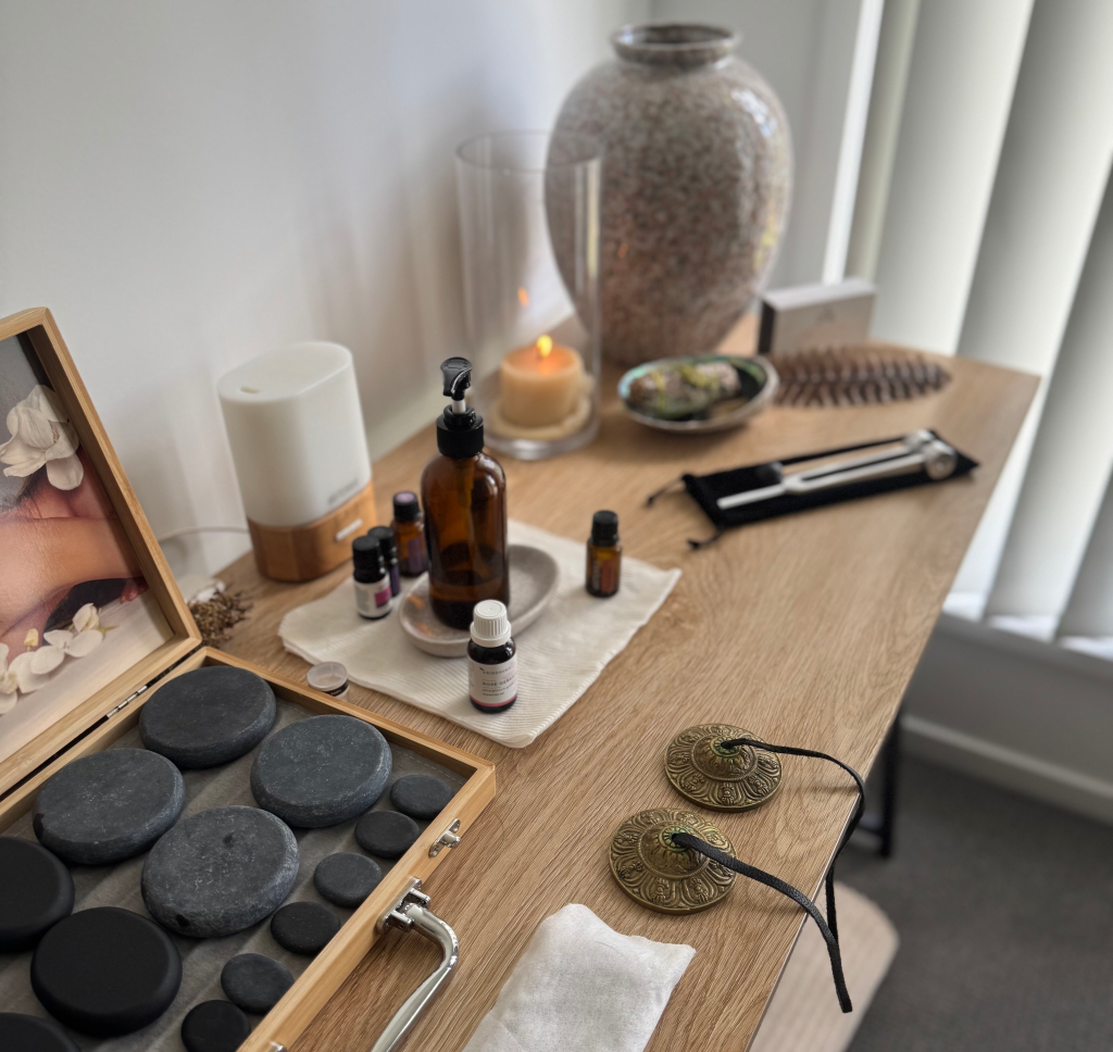Restorative energy massage tools including tuning forks, oils, and hot stones